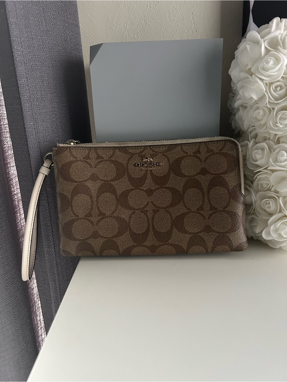 COACH Brown Signature Canvas Wristlet with Cream Strap